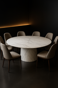 Cascade — Round Corian Dining Table in a dark luxury setting