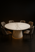 Cirrus — Round Corian Dining Table in a dark luxury setting