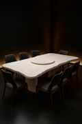 Crescent — Live-Edge Organic Corian Dining Table in a dark luxury setting