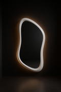 Crescent — Sculptural Asymmetric Mirror in a dark luxury setting