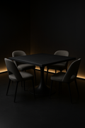 Drift — Square Corian Dining Table in a dark luxury setting
