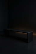 Drift — Low Media Bench in a dark luxury setting