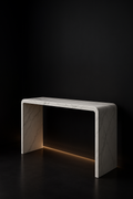 Dune — Waterfall Entryway Console in a dark luxury setting