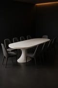 Mono Arc — Racetrack Corian Dining Table in a dark luxury setting