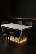 Monolith — Rectangular Corian Dining Table in a dark luxury setting