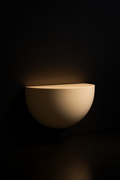 Nimbus — Demilune Console in a dark luxury setting