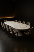 Obelisk — Racetrack Corian Dining Table in a dark luxury setting