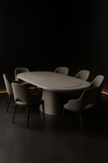 Onyx — Racetrack Corian Dining Table in a dark luxury setting