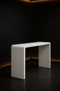 Petal — Waterfall Entryway Console in a dark luxury setting