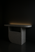 Sable — Sculptural Pedestal Console in a dark luxury setting