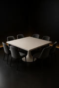 Strata — Square Corian Dining Table in a dark luxury setting