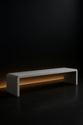 Strata — Low Media Bench in a dark luxury setting