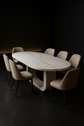 Tundra — Oval Corian Dining Table in a dark luxury setting